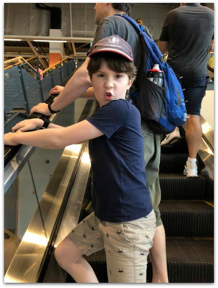 Kid on escalator at Ikea looking impressed. Project 365 photo series